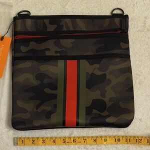 HAUTE SHORE Peyton Soho Camouflage Crossbody Bag with Red and Green Stripes
